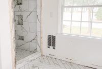 Our Faux Marble Herringbone Shower Transformation