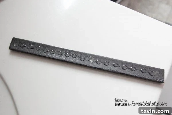 Measuring the precise widths between installed vertical moulding strips to cut the horizontal grid pieces.