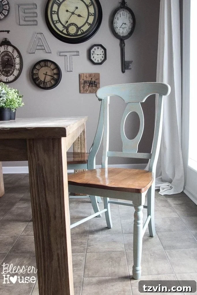 Newly painted duck egg blue dining chairs perfectly placed in a breakfast nook, hinting at a complete room makeover.