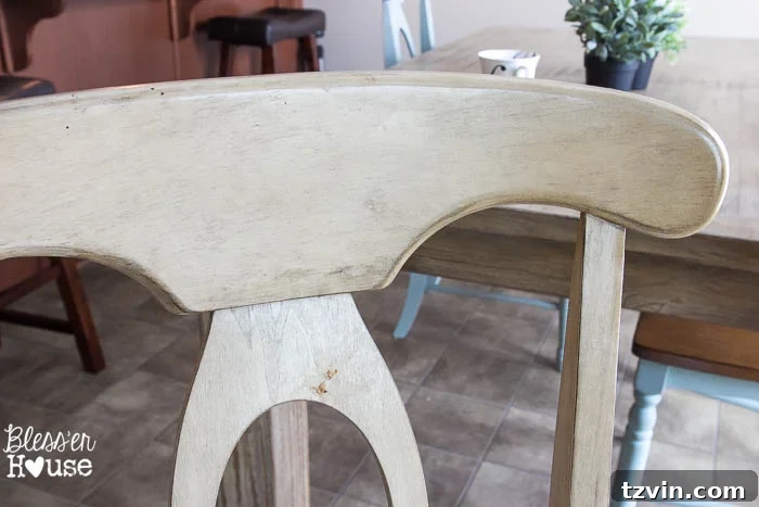 Close-up of a well-used dining chair, showing traces of daily wear and tear, and a child's breakfast mess, emphasizing the need for a durable makeover.