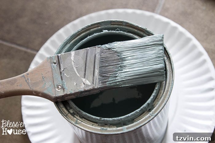 Close-up of a 1.5-inch angled Purdy's brush ready for painting, showing the quality tool used for the furniture makeover.