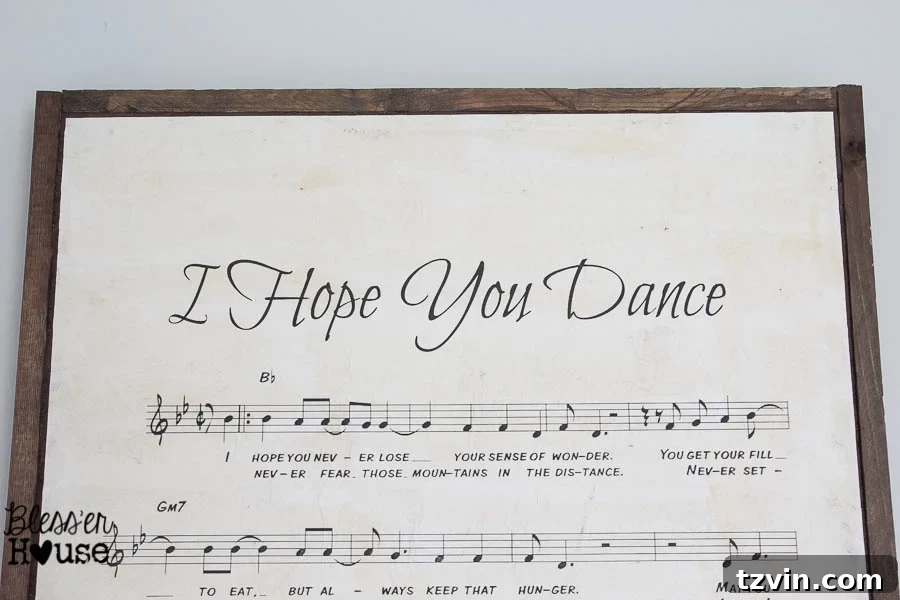 DIY Giant Sheet Music Wall Art 23 Detailed shot of the vintage-style sheet music print on the sign.