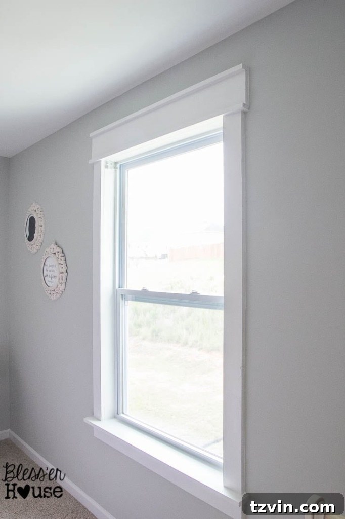 simple window casing using basic lumber with no miter cuts painted and caulked