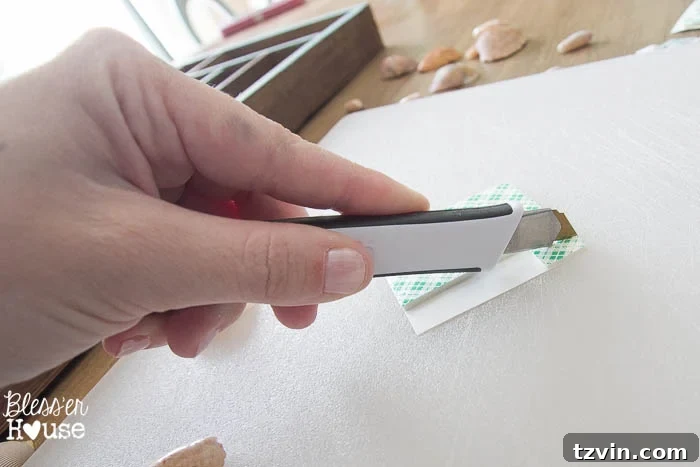 Scotch Precision Titanium Utility Knife used to cut mounting squares for small shells in a DIY coastal shadow box project. Craft tools.