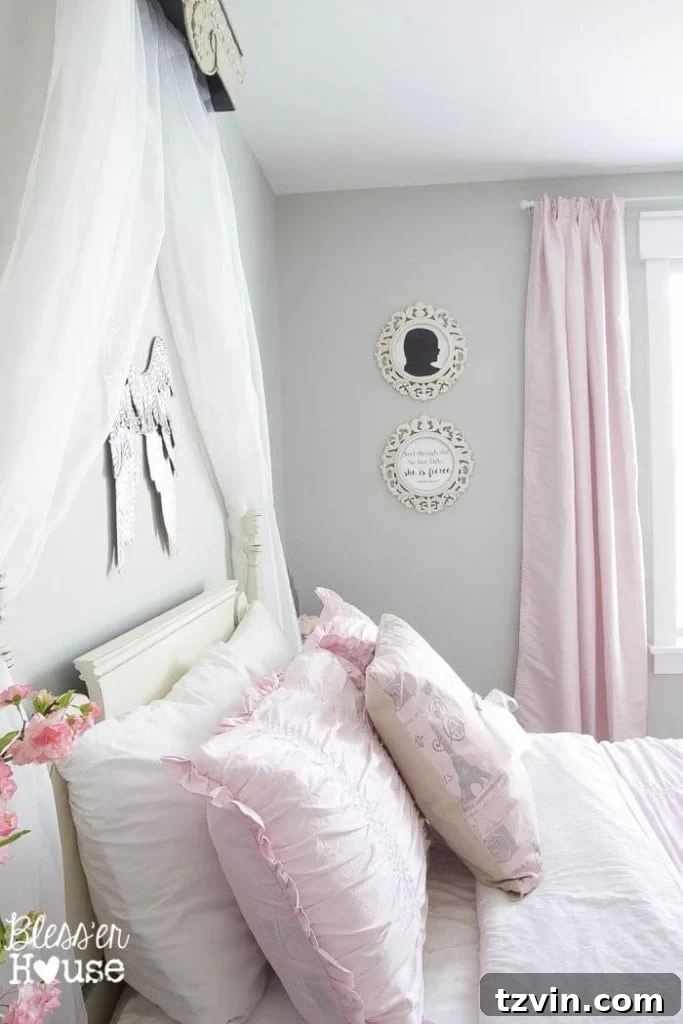 Our Prima Ballerina's Dream Bedroom Transformation 11 DIY canopy crown over bed, with silhouette art and decorative frames