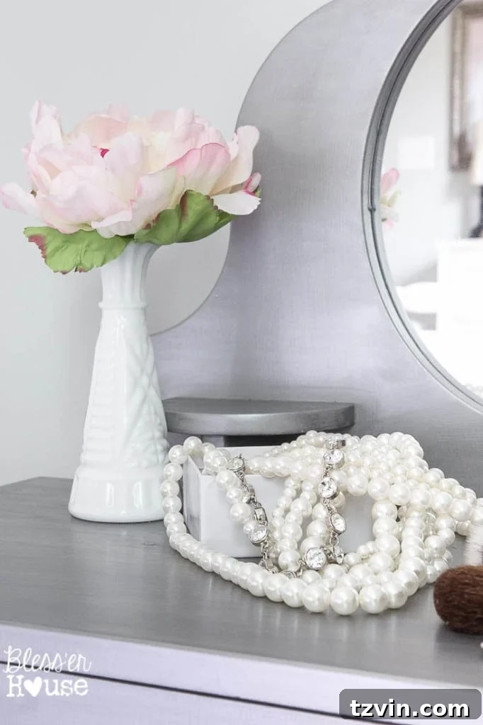 Our Prima Ballerina's Dream Bedroom Transformation 16 Little girl's hands reaching for play jewelry on a gilded vanity