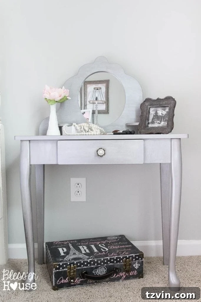 Our Prima Ballerina's Dream Bedroom Transformation 17 Child playing with blush brushes and mirror at a gilded vanity