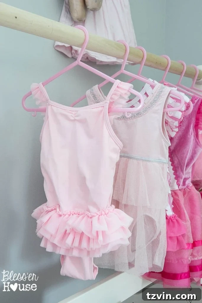 Our Prima Ballerina's Dream Bedroom Transformation 27 Little girl joyfully twirling in a dance dress in her ballet room