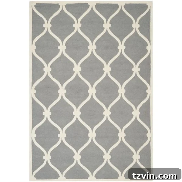 12 Greige Rugs That Look Expensive But Aren't 16 Safavieh Handmade Moroccan Cambridge Dark Grey / Ivory Wool Rug: A bold greige rug featuring a contrasting dark grey and ivory Moroccan pattern, adding dramatic flair and luxurious texture to any space. The rich tones provide depth and sophistication.