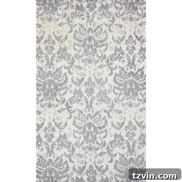 12 Greige Rugs That Look Expensive But Aren't 18 NuLOOM Transitional Damask Microfiber Grey Rug: Experience ultimate softness with this greige microfiber rug featuring a classic transitional damask pattern, perfect for adding plush comfort and understated elegance. Its microfiber construction offers exceptional softness.