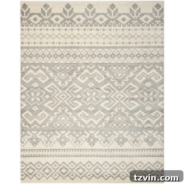 12 Greige Rugs That Look Expensive But Aren't 7 Safavieh Adirondack Ivory / Silver Rug: A beautifully patterned greige rug offering a blend of ivory and silver tones for a sophisticated, distressed look. Ideal for adding subtle elegance to any living space or bedroom, providing both style and durability.