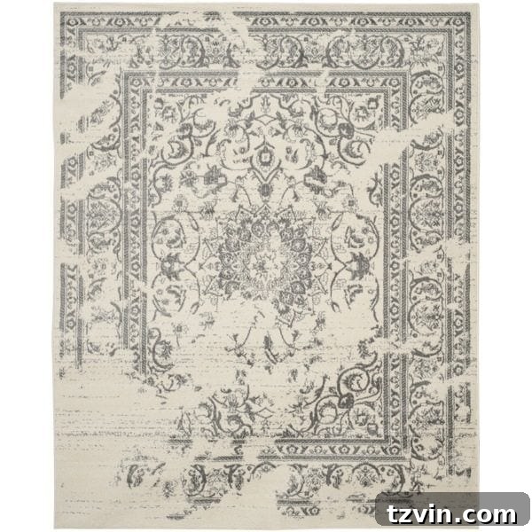 12 Greige Rugs That Look Expensive But Aren't 8 Safavieh Adirondack Silver / Ivory Rug: A versatile greige rug with a delicate pattern, featuring cool silver and soft ivory shades, perfect for creating a serene and inviting atmosphere in any modern or traditional setting, blending seamlessly with diverse decor.