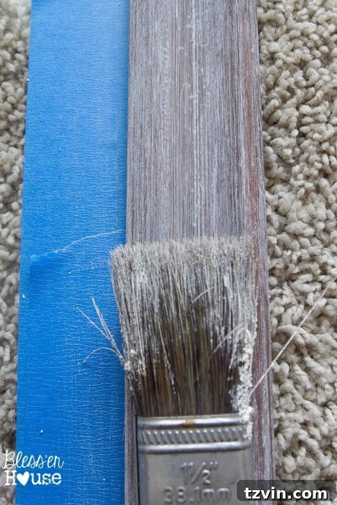 Botanical Blooms from Book Pages 5 Applying and buffing liming wax on a wood picture frame