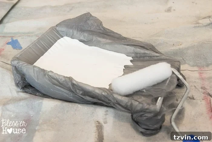 DIY paint tray liner hack using a plastic bag.