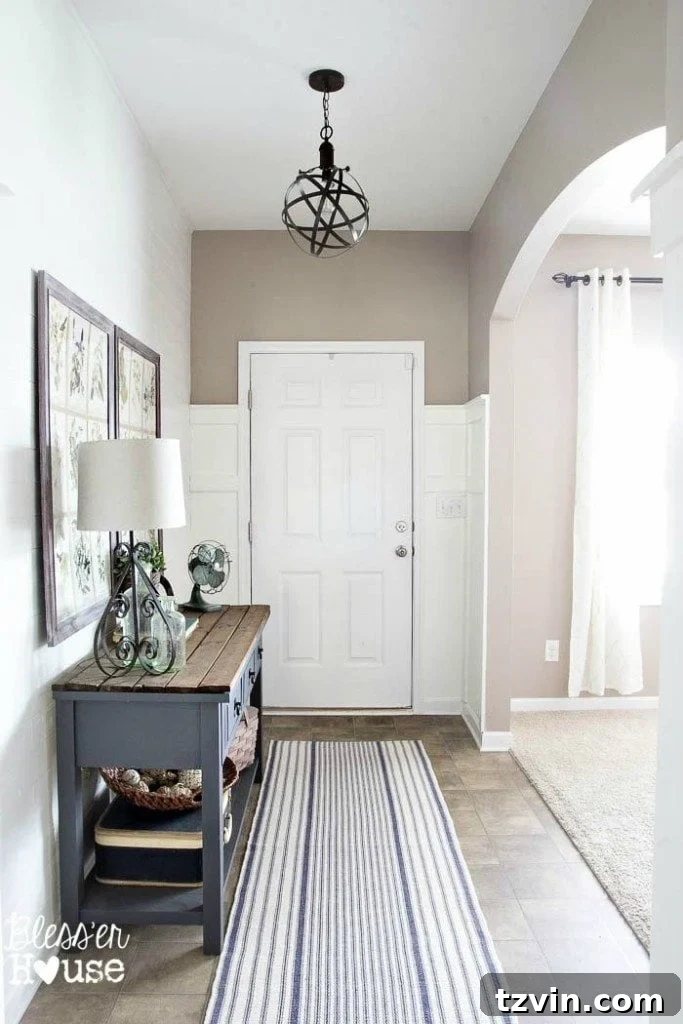 Front door and newly painted board and batten, awaiting a new door color.