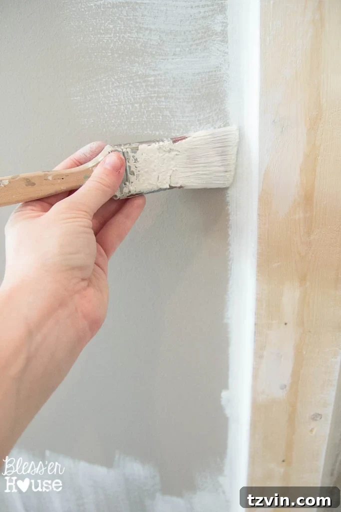 Crisp Linen White Glidden paint and brush.