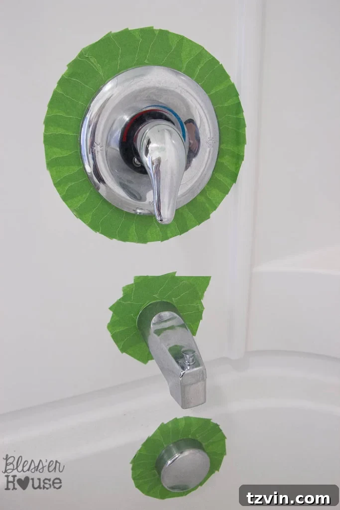 Revamp Your Bathroom Fixtures with Spray Paint 6 painter's tape to spray paint faucet