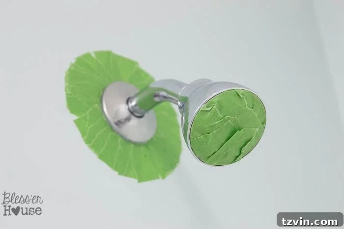 Revamp Your Bathroom Fixtures with Spray Paint 7 painter's tape to spray paint a shower head