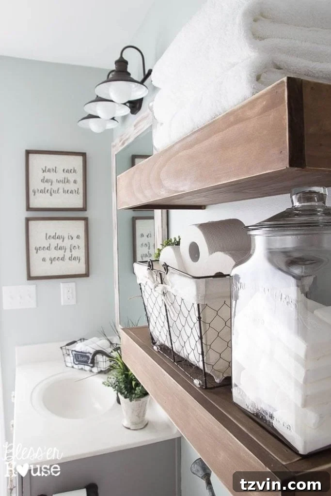 Detail shot of the modern farmhouse bathroom shelves with decorative elements and practical storage solutions for guests.