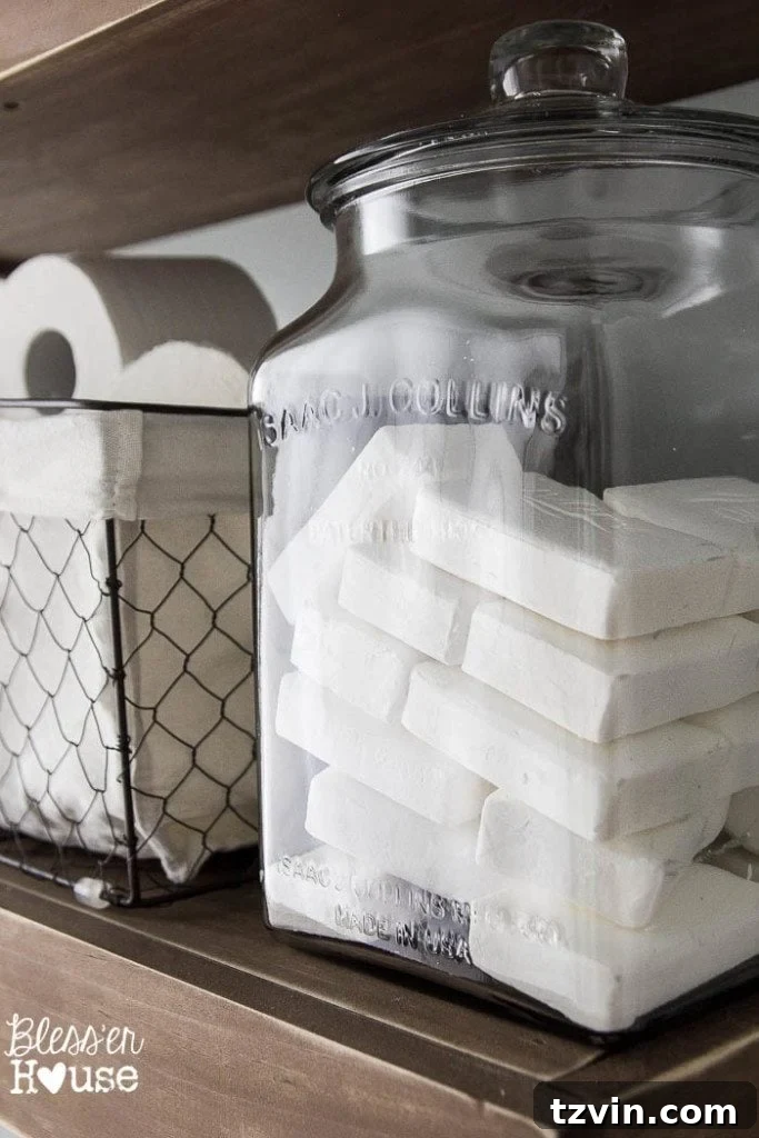 Stylish organization solutions from Walmart, including a chicken wire basket and glass soap jar, enhancing the farmhouse bathroom's practical charm.