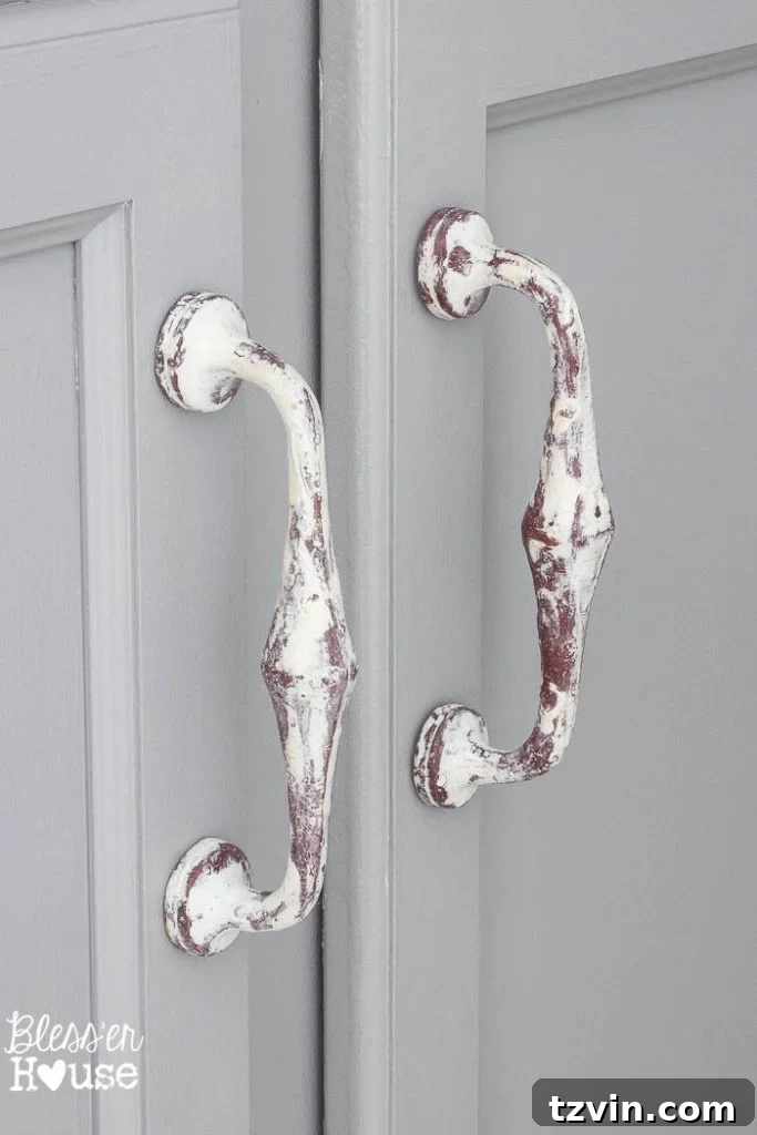 Close-up of the cabinet handles and knobs from Hobby Lobby, complementing the mirror and overall modern farmhouse style.
