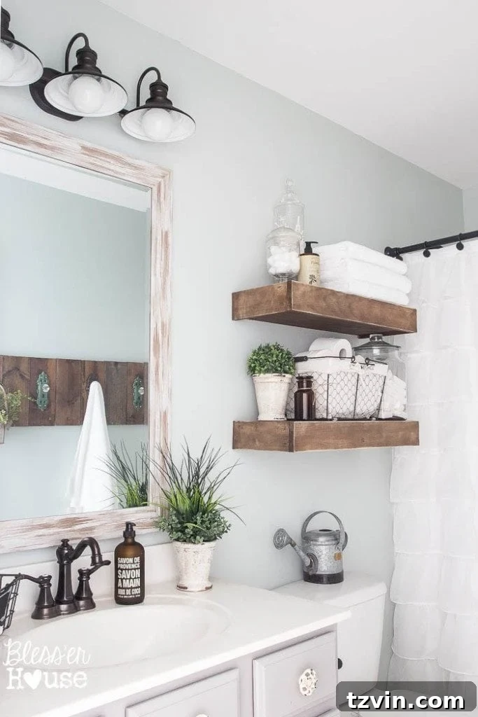 DIY towel rack crafted from scrap wood and antique doorknob hooks, a perfect budget-friendly addition to the modern farmhouse bathroom decor.
