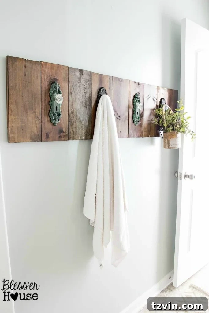 A close-up of the DIY antique doorknob towel rack, showcasing the rustic charm and creative repurposing of materials.