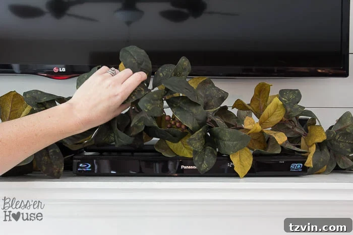Concealing Tech on a Mantel 5 Hiding Electronics with Garland