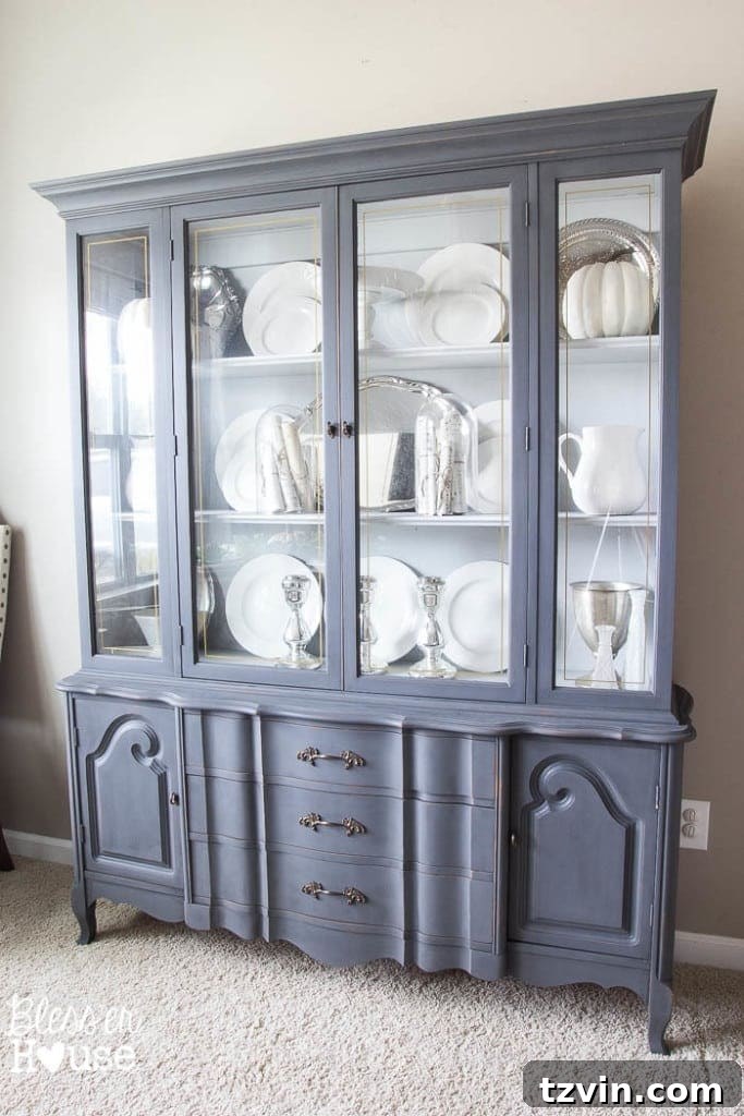 French Provincial Hutch Reimagined 12 French Provincial China Cabinet Makeover: Wider shot of the dining room with the new cabinet, emphasizing space