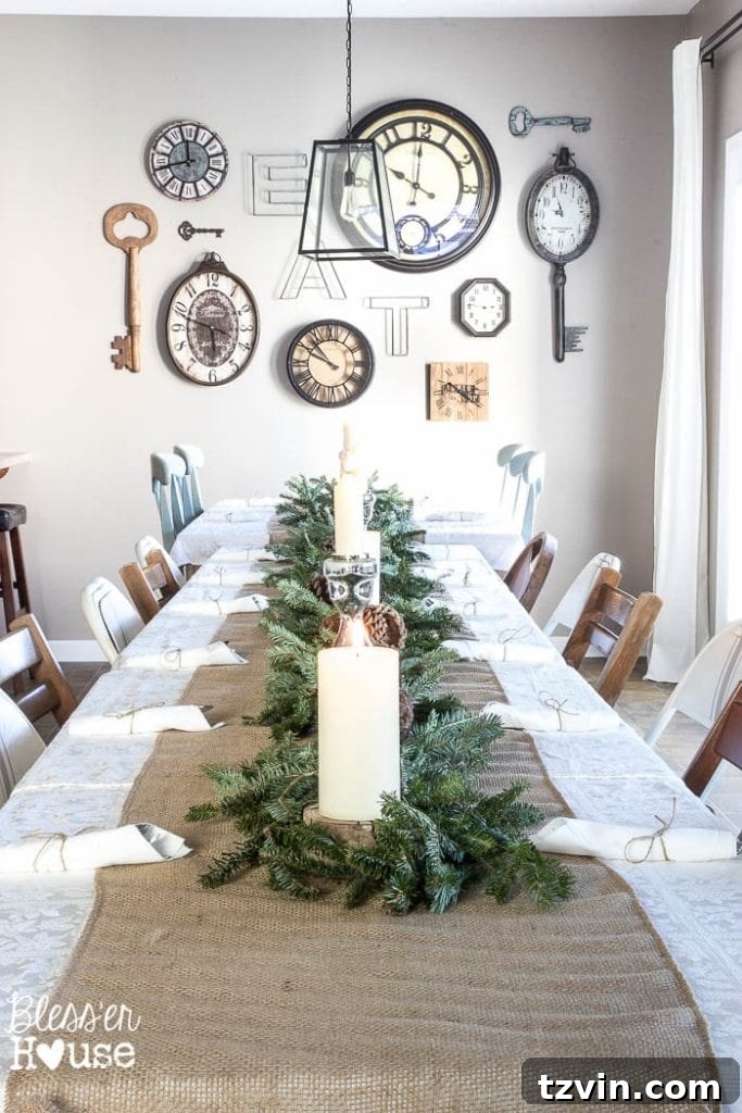 Adding greenery and pinecones to holiday table centerpiece