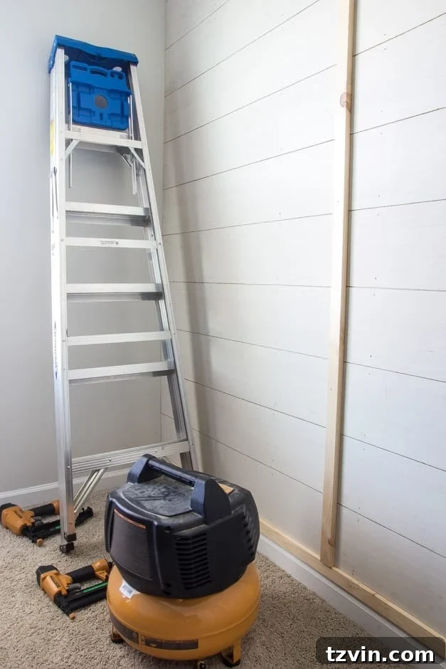 DIY Planked Board and Batten Accent Wall nearing completion