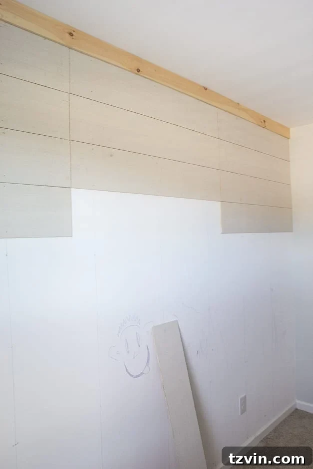 Nailing plywood planks for the DIY accent wall