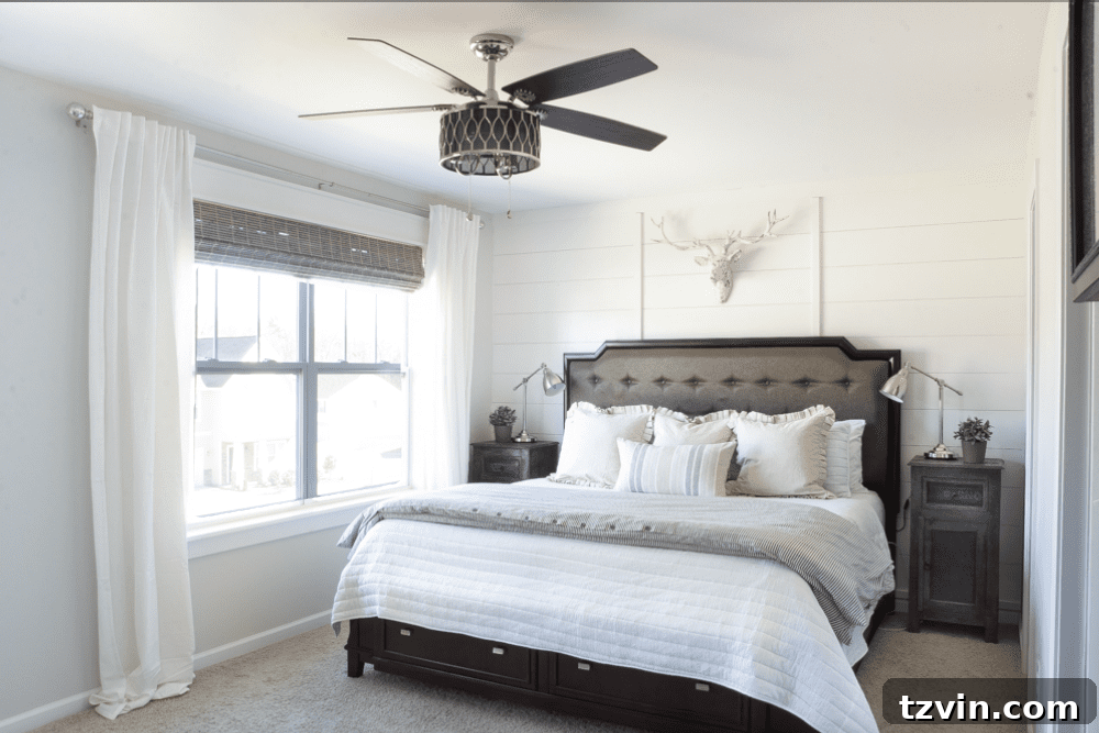 3 Smart Ways to Elevate Basic Windows 3 After: Master Bedroom Window with New Craftsman Trim, Roman Shade, and White Curtains