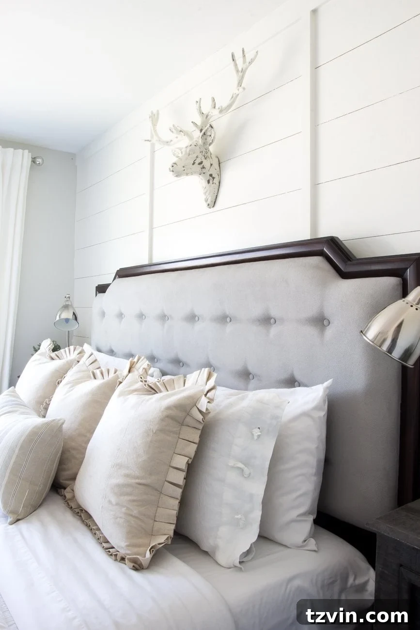 Revitalize Your Sofa: Easy Upholstery Painting 11 Finished painted headboard in a rustic modern master bedroom