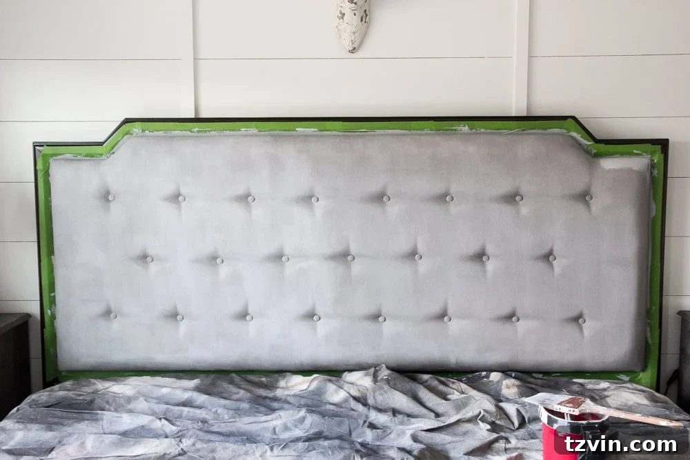 Revitalize Your Sofa: Easy Upholstery Painting 6 First coat of chalk paint on upholstered headboard, showing initial unevenness