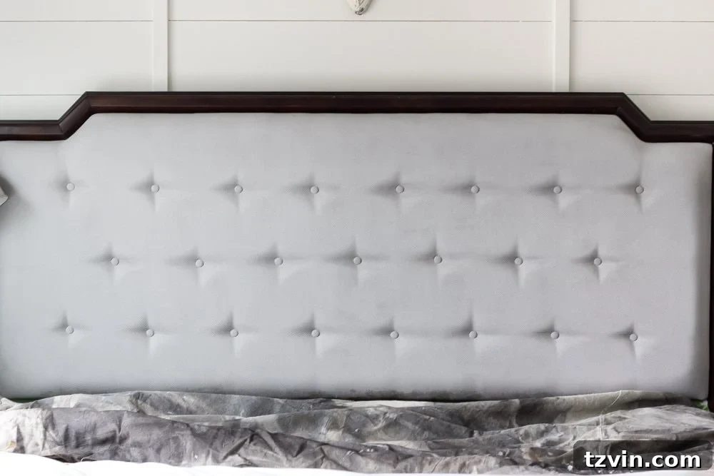 Revitalize Your Sofa: Easy Upholstery Painting 7 Second coat of chalk paint on upholstered headboard showing improved coverage