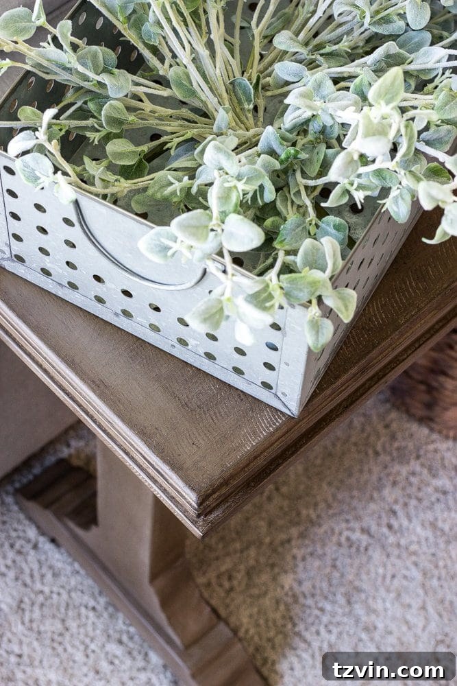 Finished weathered wood table placed behind a couch in a living room