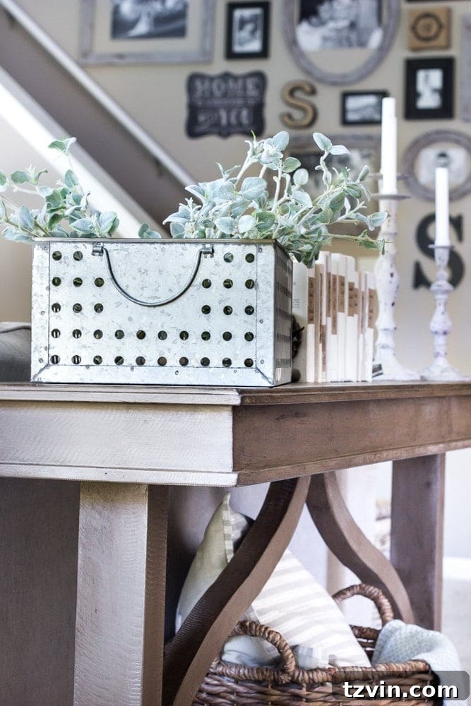 Styled weathered wood console table with decorative accents
