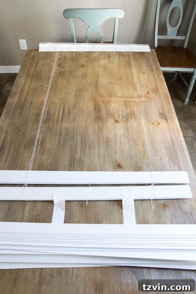 Selected slats arranged on the blind mechanism, ready for fabric attachment for DIY Roman shades
