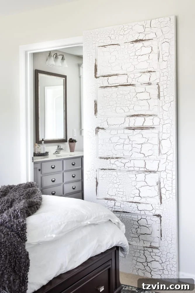 Vintage Makeover: Distressing Hollow Core Doors 10 Distressed door in a rustic modern master bedroom
