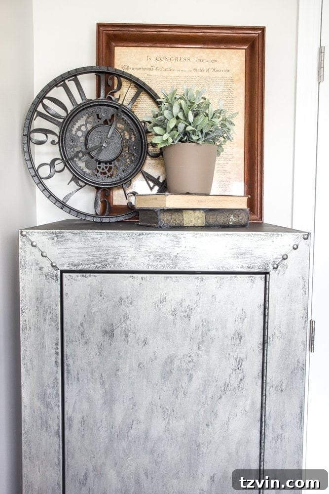 Transformed Faux Zinc Safe in Military Office | blesserhouse.com - A DIY safe makeover with thrifted decor on top, enhancing the industrial theme.