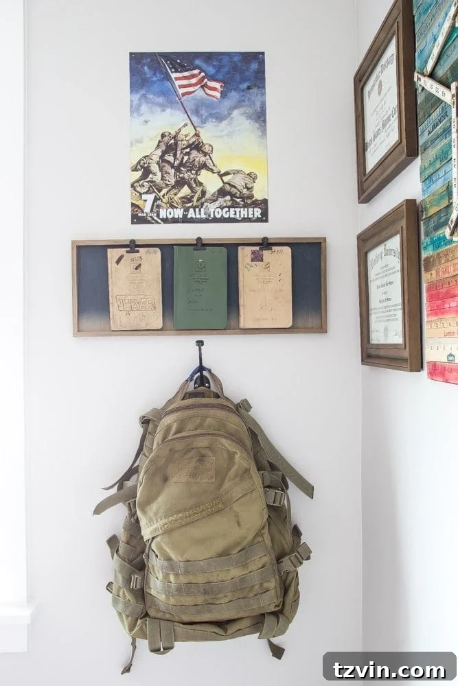 Military Memorabilia Displayed on Gallery Wall | blesserhouse.com - Featuring a WWII relic, military pack, and field books.