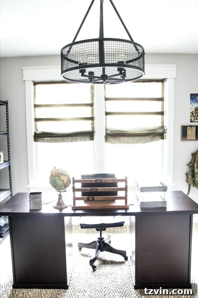 Finished Window with DIY Roman Shades and Herringbone Rug | blesserhouse.com - The complete window treatment and flooring in the industrial military office.