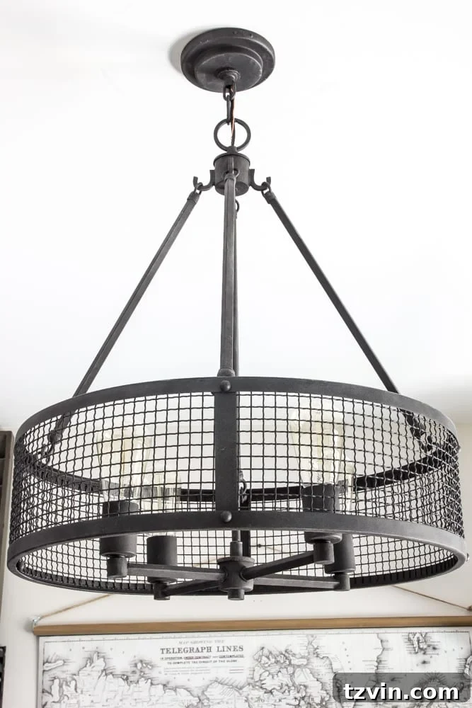 Quoizel Wilder Drum Pendant in Industrial Military Office | blesserhouse.com - Close-up of the new statement light fixture in the masculine office.