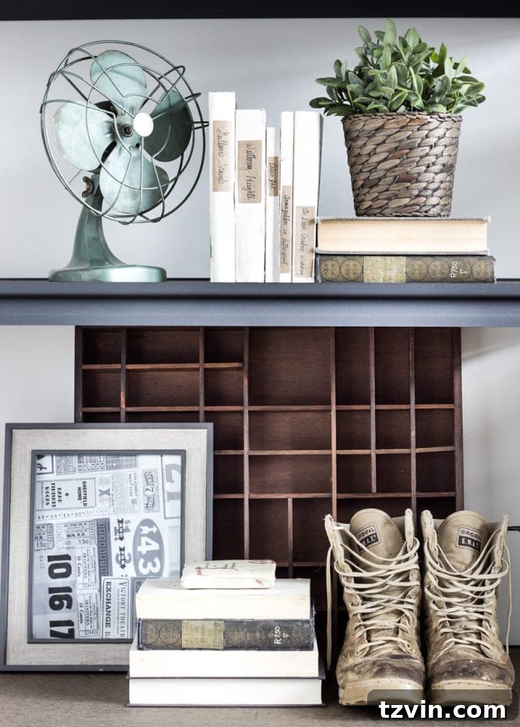 Curated Industrial Shelving in a Military-Themed Office | blesserhouse.com - Displaying military mementos and thrift finds on industrial shelves.