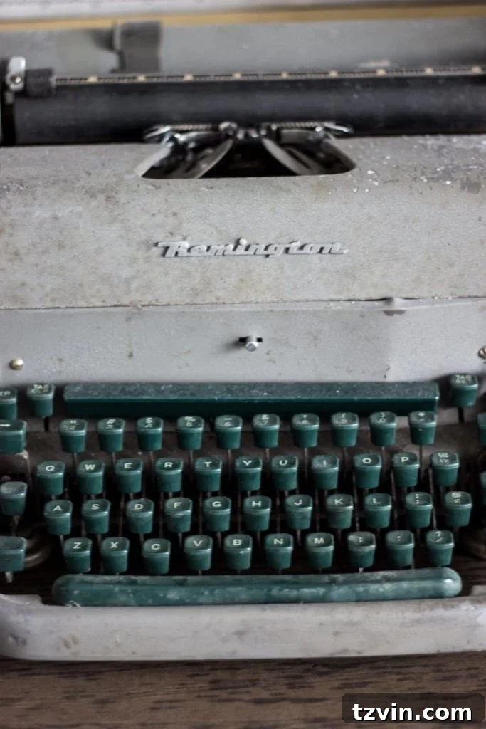 Vintage Typewriter and Unified Books on Office Shelves | blesserhouse.com - Creative book styling and thrifted decor for a military office.