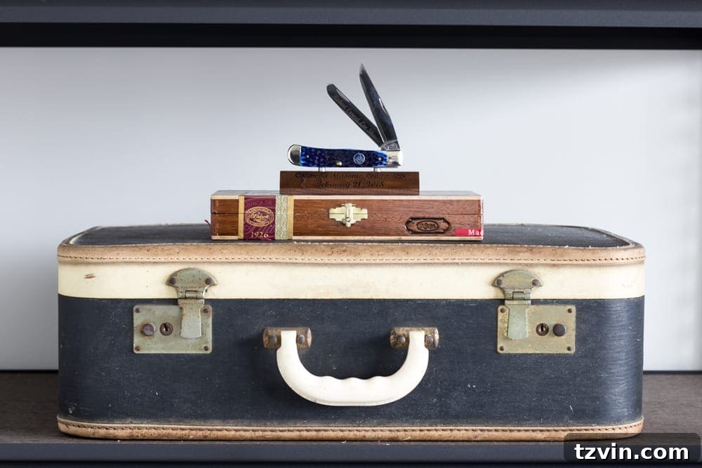 Grandmother's Suitcase and Grandfather's Bookends in Office | blesserhouse.com - Family heirlooms adding personal history to a masculine home office.