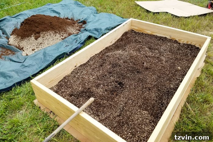 Raised Bed Revolution: Achieving Abundant Vegetable Harvests 11 mixing soil, peat moss, vermiculite, and compost together for building a raised bed vegetable garden frame