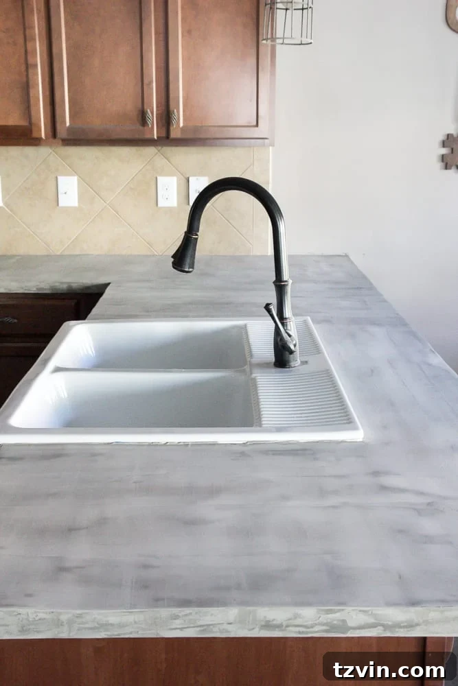 Smooth, finished skim coat concrete countertop after multiple layers and sanding