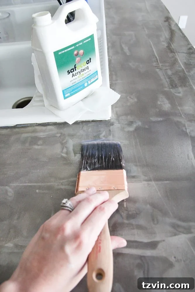 Applying Safecoat Acrylacq topcoat to achieve a glossy concrete finish